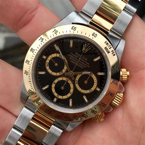 rolex daytona two tone gold dial black ring|Rolex daytona price list.